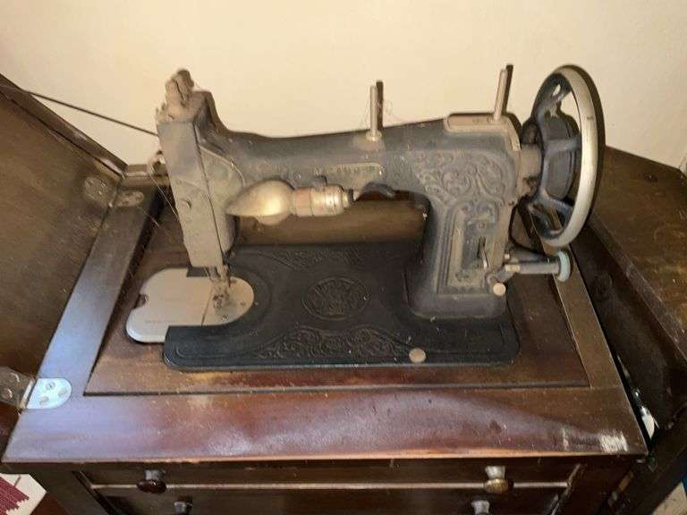 ANTIQUE WHITE BRAND SEWING MACHINE W/STAND, WOOD PLANTER AND CONTENTS PICTURED