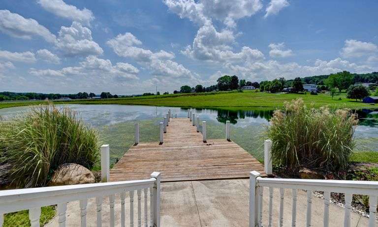 Parcel 1: 9.4 Acres with Farmstead, Pond and Cabin.
