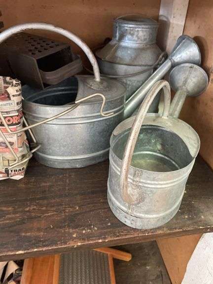 CONTENTS INCLUDING HUMMEL DECOR PLATES, VINTAGE WATERING CANS AND MORE