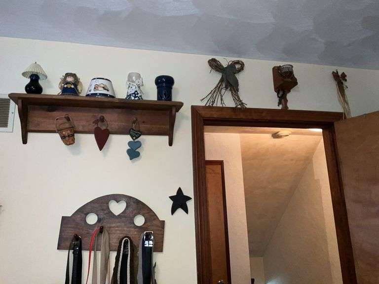WOODEN SHELVES AND RUSTIC DECOR ON WALL