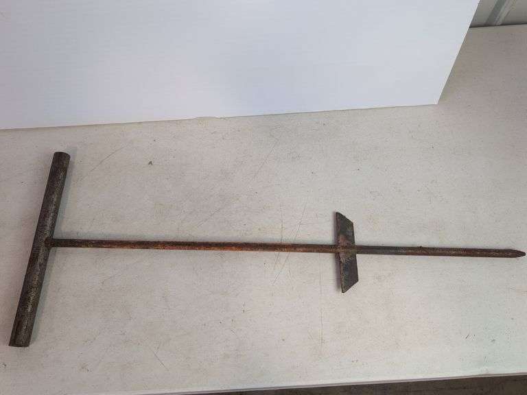Large cast iron decorative piece and t-handled tool