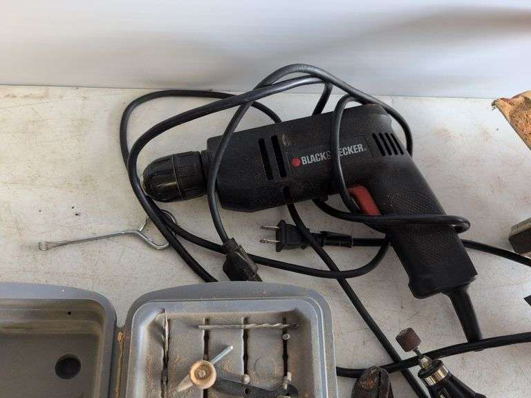 Black and Decker drill, Dremel and accessories, saw, staple gun, other tools, and model airplane