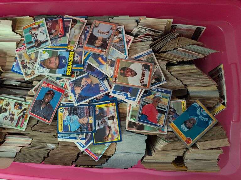 Tote full of 80s and 90s baseball, football, and basketball cards