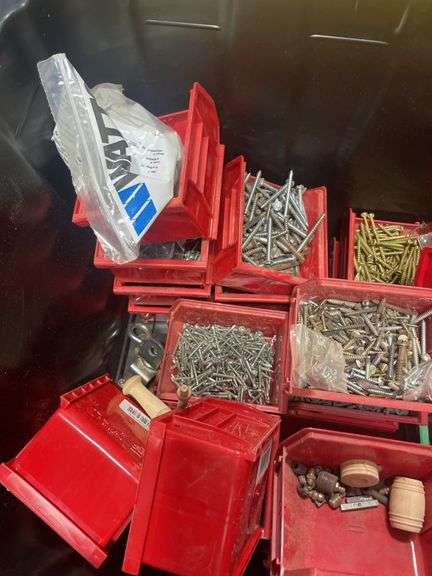 Tote of screws, woodworking supplies, and hardware