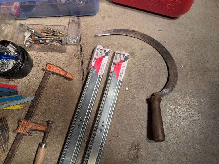 Miscellaneous tools and hardware - gas can, clamps, scythe, railroad nails, hacksaw blades, and more