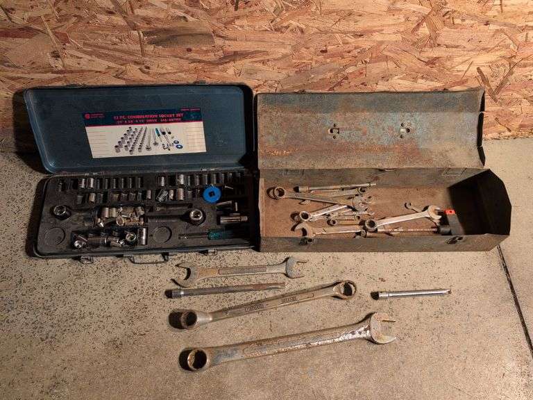 Metal toolboxes with wrenches and sockets