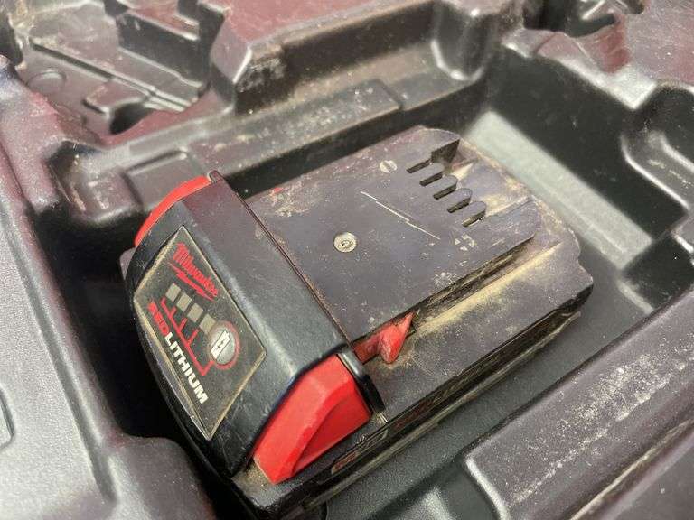 Milwaukee pack out and tool box with drill, impact, battery and charger