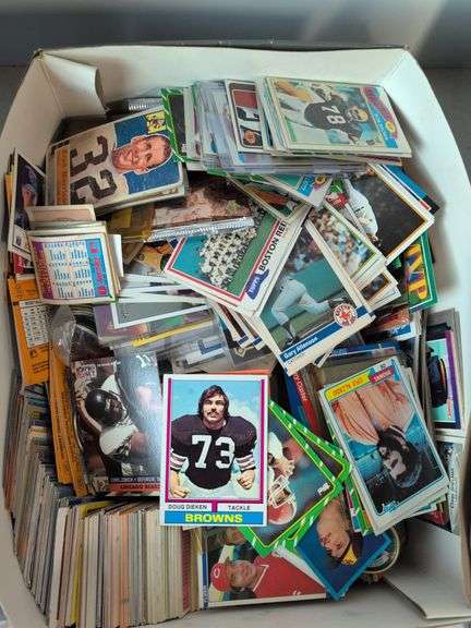 Football, baseball, and basketball trading cards with extra binder sleeves