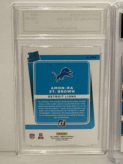 2021 Donruss Rated Rooke Amon-Ra St. Brown (SGC 10) and 2023 Select Sam LaPorta Concourse Rookie (GM