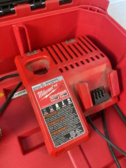 Milwaukee pack out and tool box with drill, impact, battery and charger