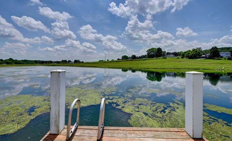 Parcel 1: 9.4 Acres with Farmstead, Pond and Cabin.