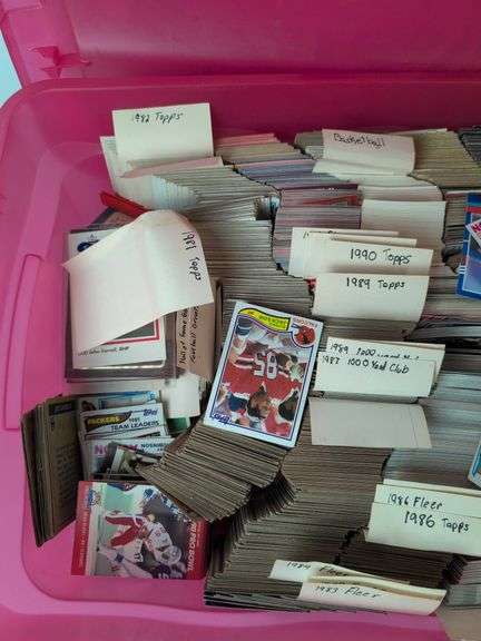 Tote full of 80s and 90s baseball, football, and basketball cards