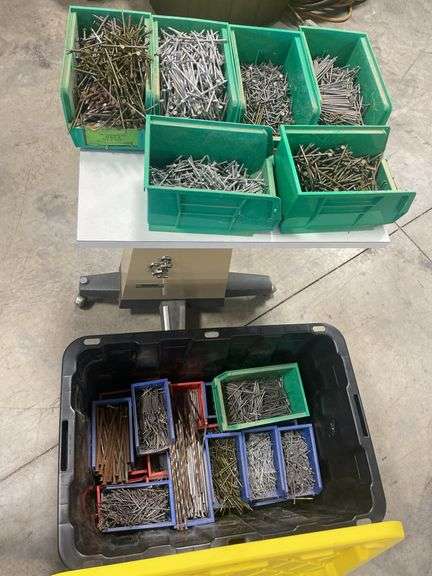 Tote of various nails in containers
