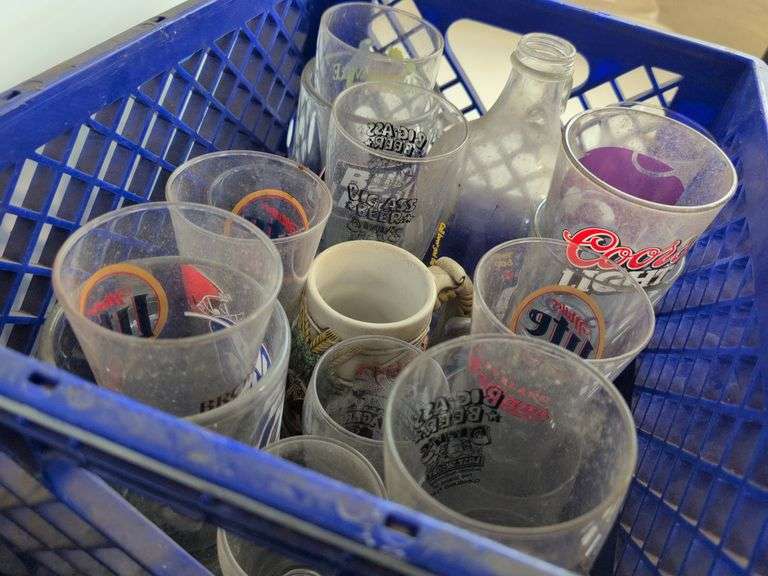 Bar glasses with sports logos in (2) milk crates