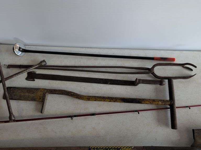 Firebird fishing rod, roofing shovel, tire iron, magnet, and other tools