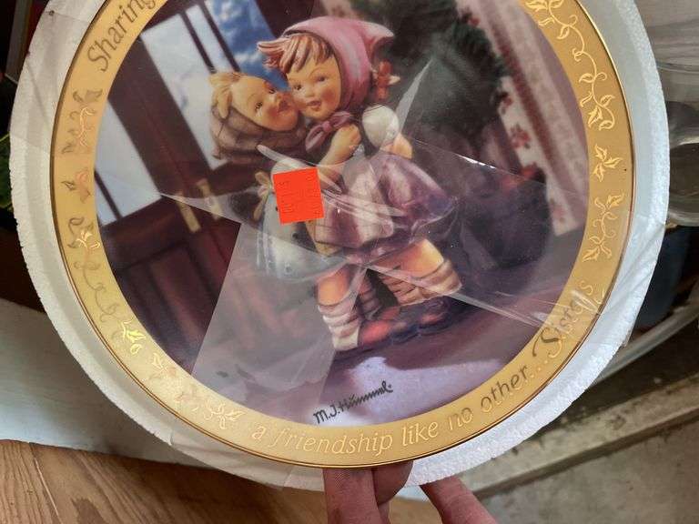CONTENTS INCLUDING HUMMEL DECOR PLATES, VINTAGE WATERING CANS AND MORE