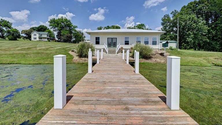 Parcel 1: 9.4 Acres with Farmstead, Pond and Cabin.