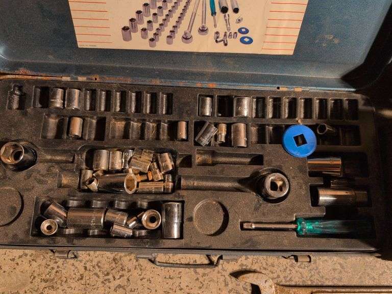 Metal toolboxes with wrenches and sockets
