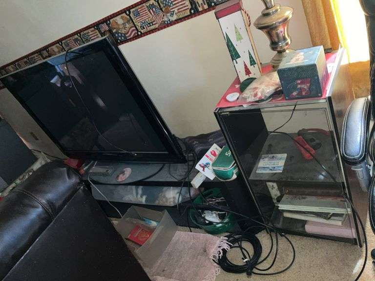 TV W/STAND, CABINET AND ALL CONTENTS