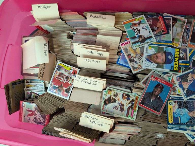 Tote full of 80s and 90s baseball, football, and basketball cards