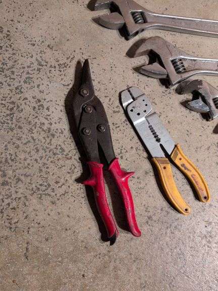 (5) adjustable wrenches, wire stripper, and metal snips