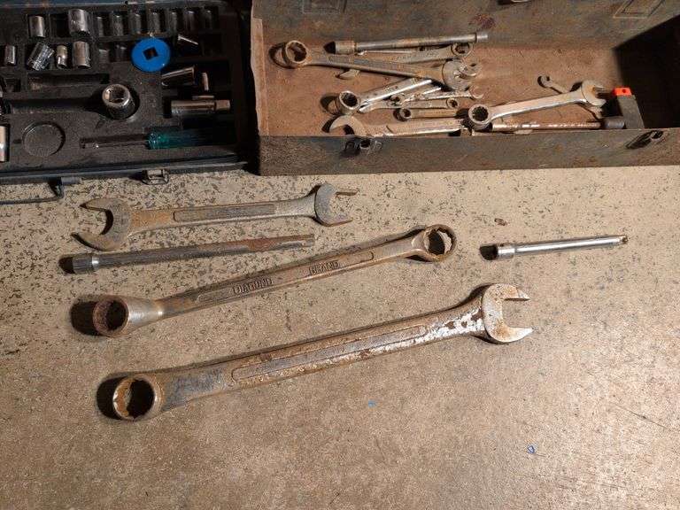 Metal toolboxes with wrenches and sockets