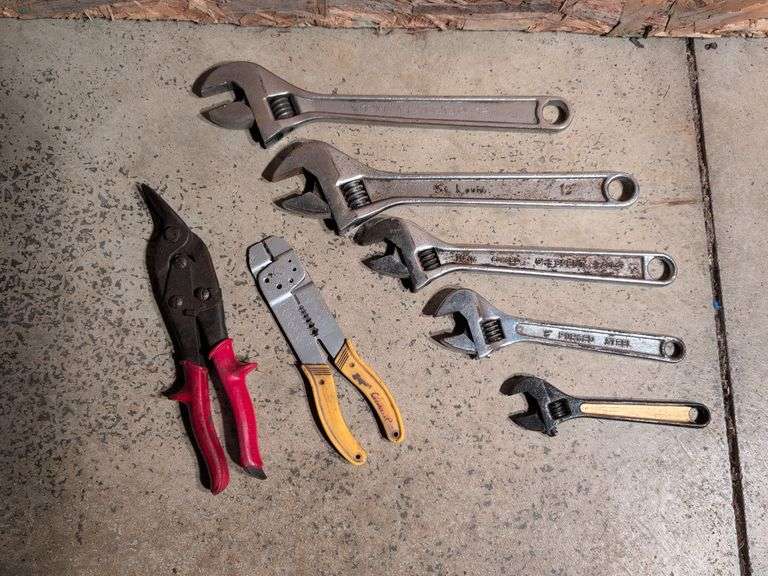 (5) adjustable wrenches, wire stripper, and metal snips
