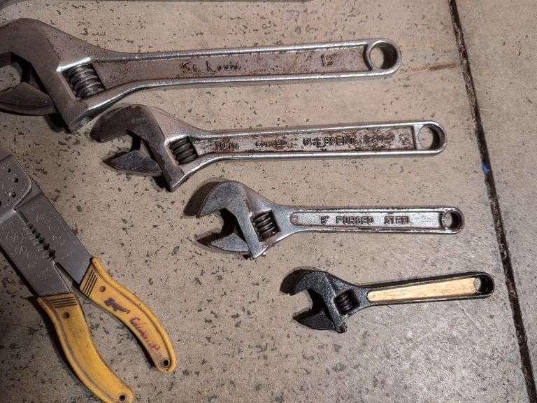 (5) adjustable wrenches, wire stripper, and metal snips
