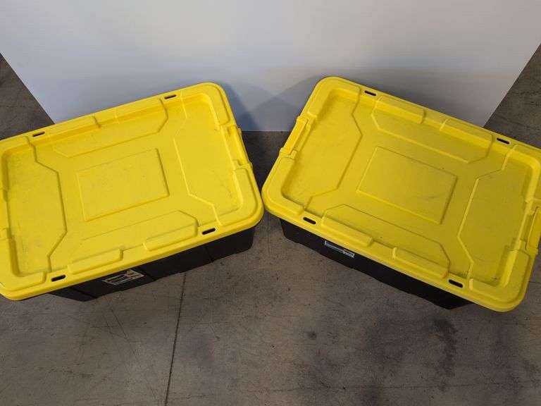 (2) black Sterilite industrial storage containers with yellow lids and handles