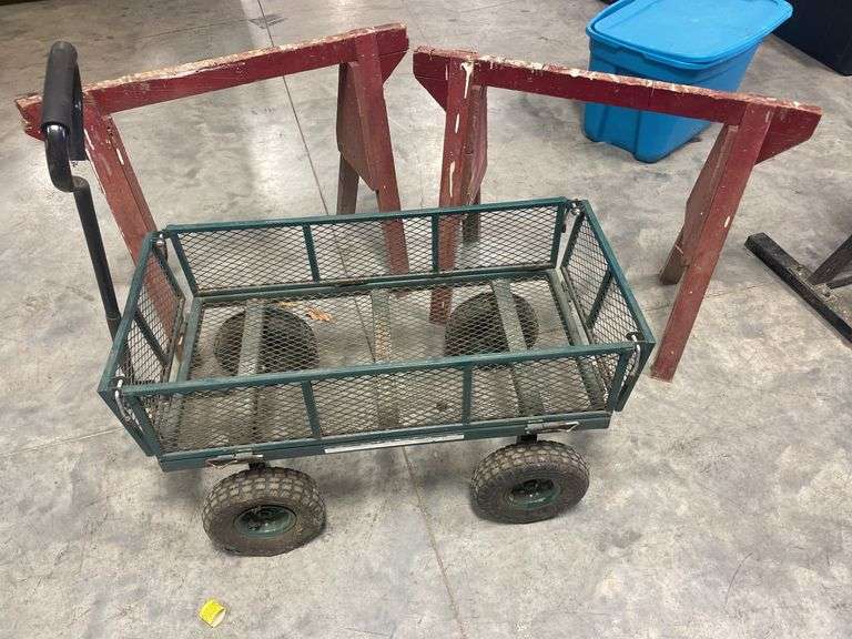 Green metal wagon with (2) saw horses