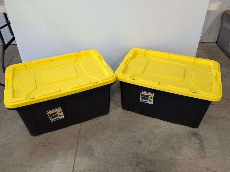 (2) black Sterilite industrial storage containers with yellow lids and handles