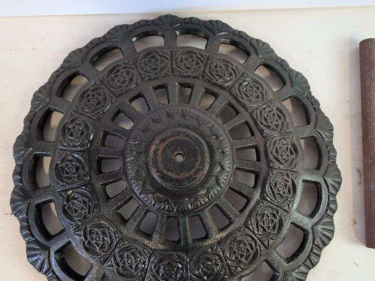 Large cast iron decorative piece and t-handled tool