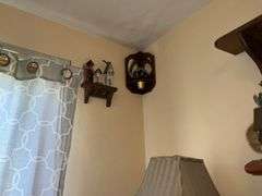 WOODEN SHELVES AND RUSTIC DECOR ON WALL