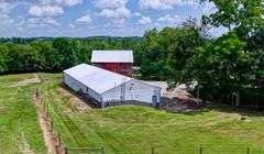 Parcel 1: 9.4 Acres with Farmstead, Pond and Cabin.