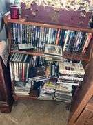 WOOD CABINET W/SPEAKERS AND SHELF OF DVD'S/CD'S