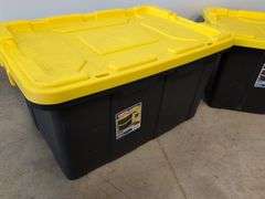 (2) black Sterilite industrial storage containers with yellow lids and handles