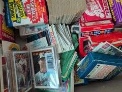 Football, baseball, and basketball trading cards with extra binder sleeves