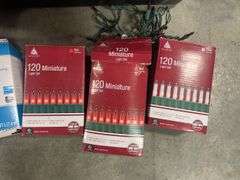 Tote of Christmas lights and decorative bulbs