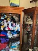 BOOKSHELF AND GLASS SHOWCASE W/ALL DOLLS. BLANKETS, AND FABRIC REMNANTS