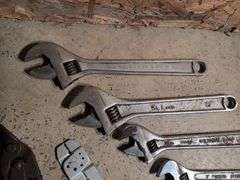 (5) adjustable wrenches, wire stripper, and metal snips