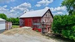 Parcel 1: 9.4 Acres with Farmstead, Pond and Cabin.