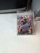 Football, baseball, and basketball trading cards with extra binder sleeves