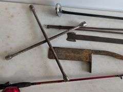 Firebird fishing rod, roofing shovel, tire iron, magnet, and other tools