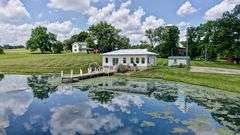 Parcel 1: 9.4 Acres with Farmstead, Pond and Cabin.