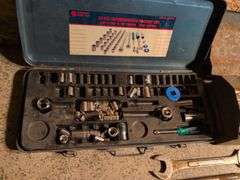 Metal toolboxes with wrenches and sockets