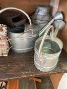 CONTENTS INCLUDING HUMMEL DECOR PLATES, VINTAGE WATERING CANS AND MORE