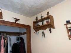 WOODEN SHELVES AND RUSTIC DECOR ON WALL