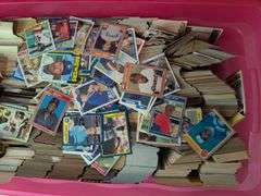 Tote full of 80s and 90s baseball, football, and basketball cards