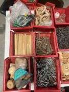 Tote of screws, woodworking supplies, and hardware