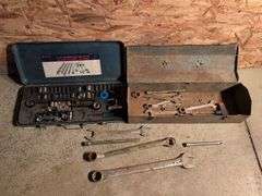 Metal toolboxes with wrenches and sockets